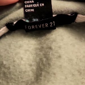 Green zip up jacket.